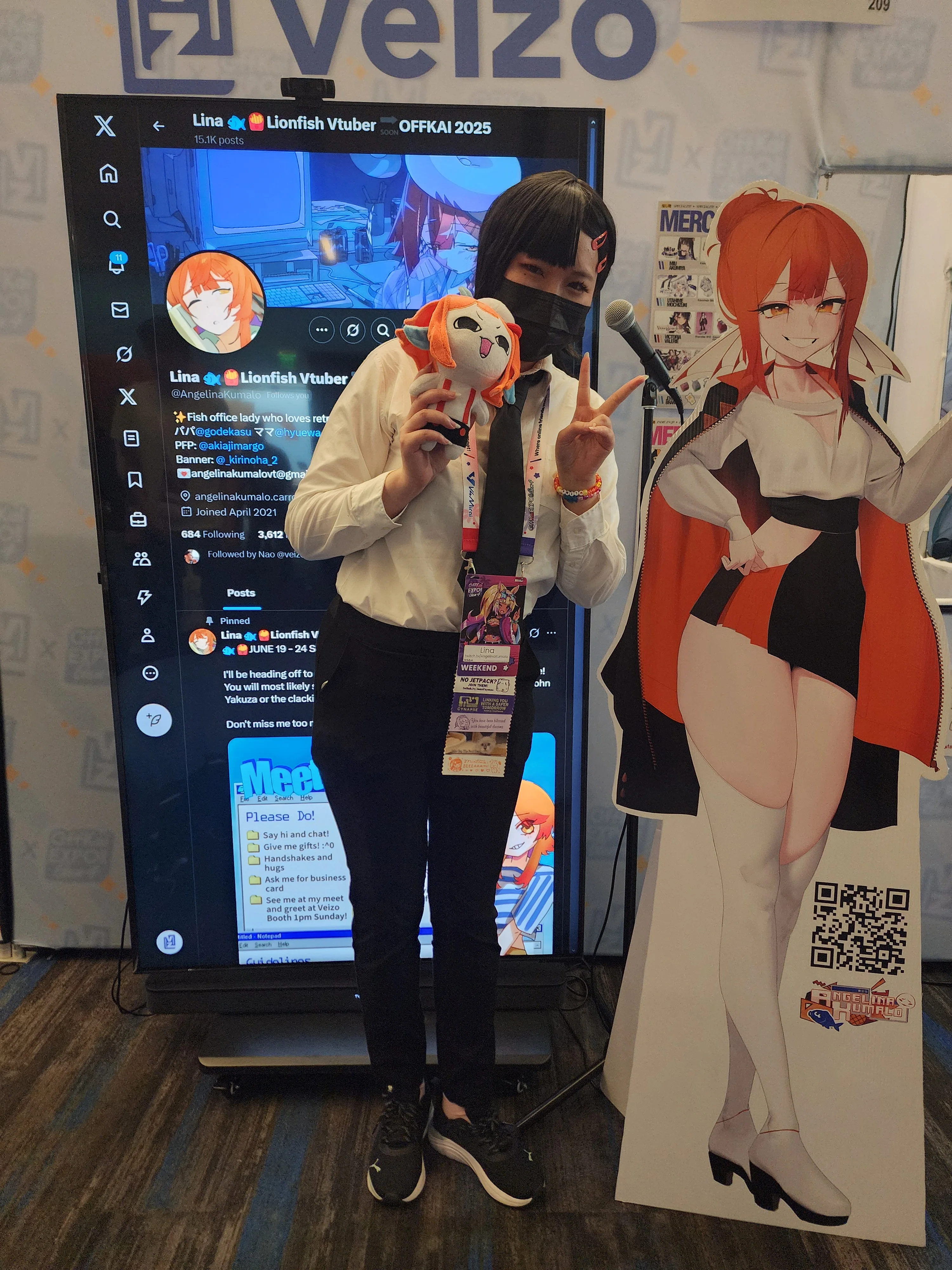 Convention booth with branded display and visitors